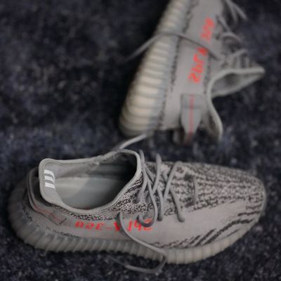 Sport shoes on a dark textured floor surface